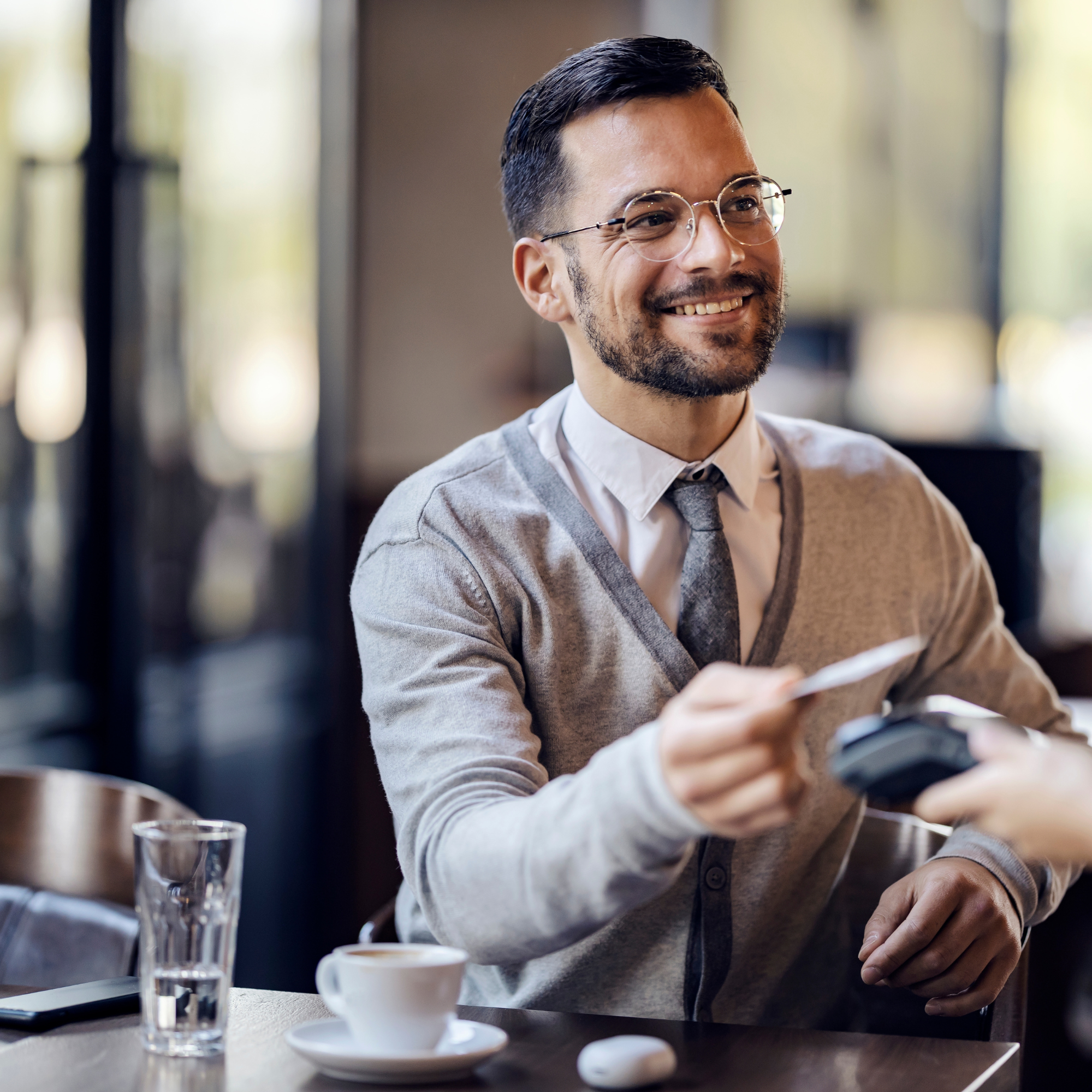 Man using credit card to pay at a restaurant
