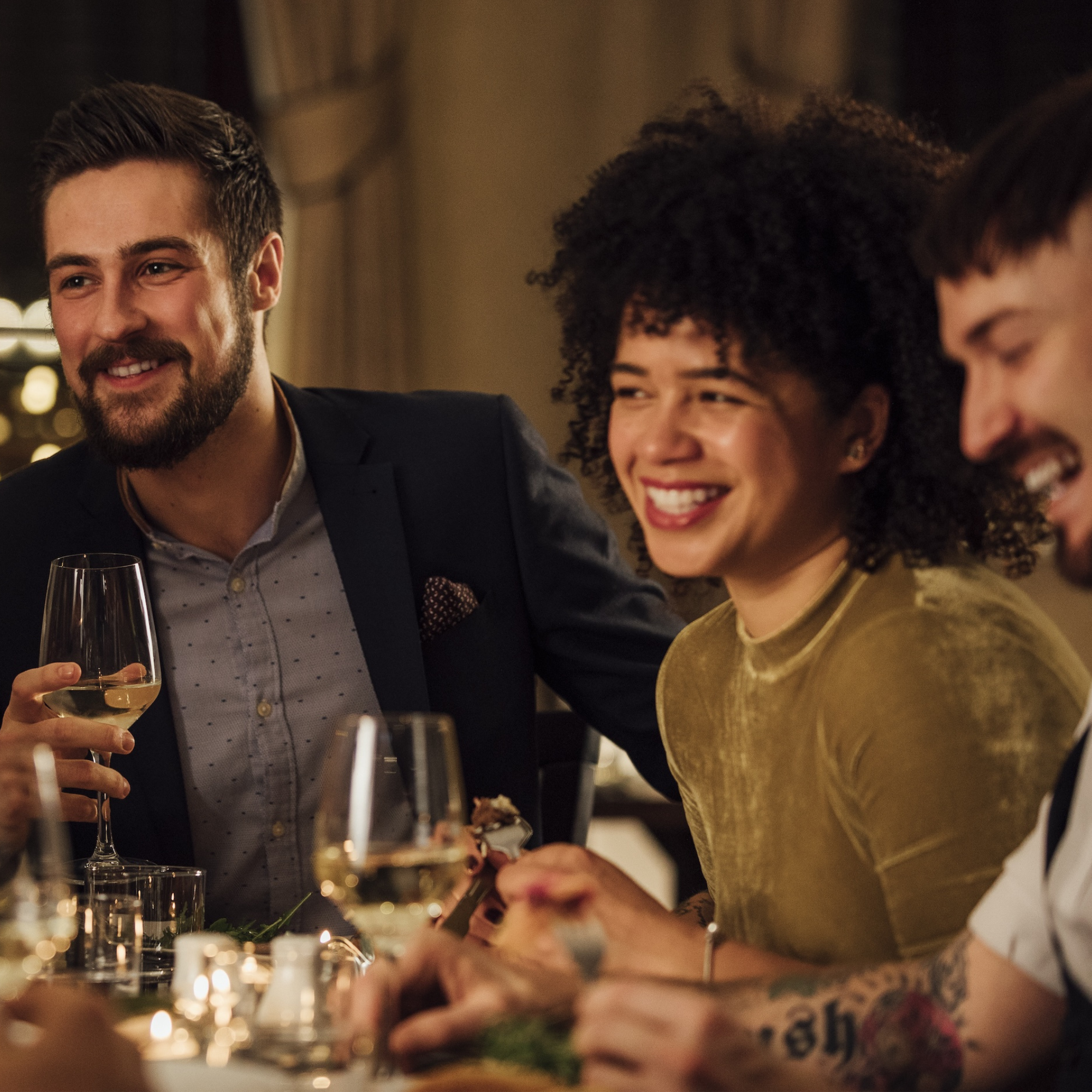 group of friends enjoying a meal at a fine dining establishment