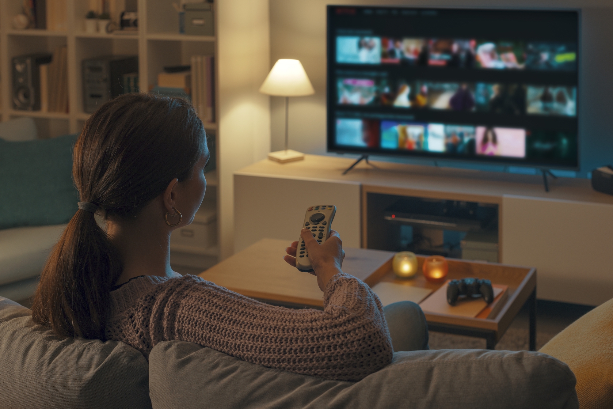 woman relaxing on couch watch ctv/ott