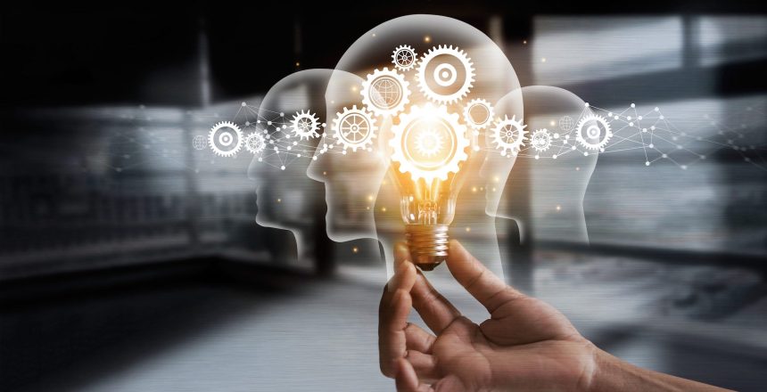 Hand holding light bulb and cog inside. Idea and imagination. Creative and inspiration. Innovation gears icon with network connection on metal texture background. Innovative technology industrial.