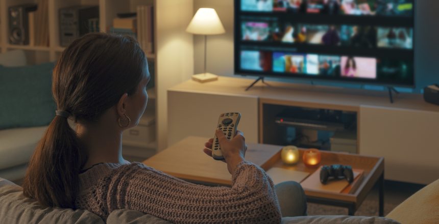 woman relaxing on couch watch ctv/ott