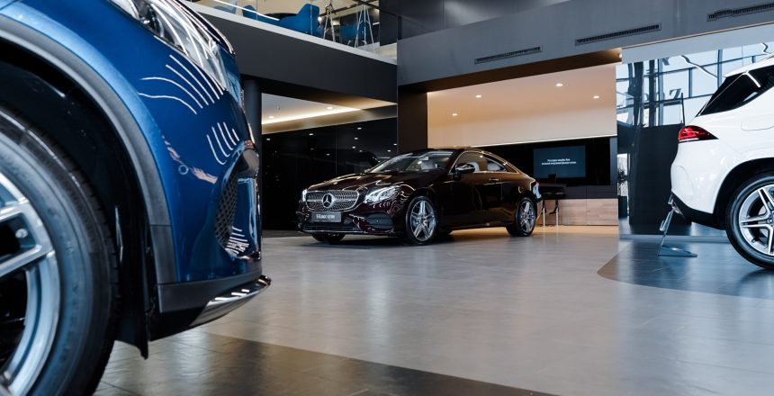 cars sitting inside a dealership