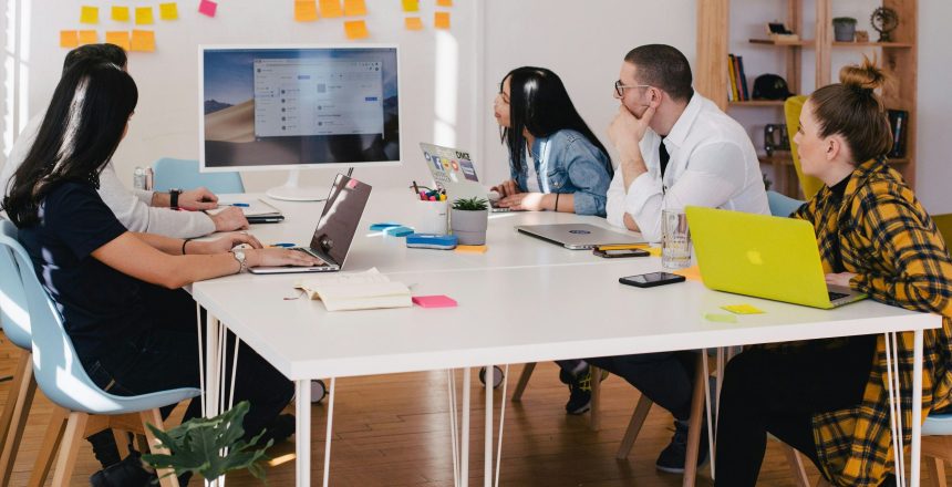 people sitting around an agency office,