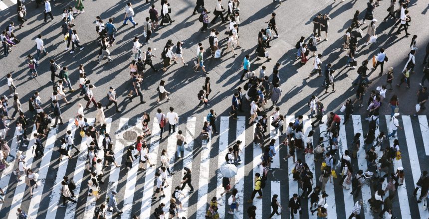 large group of people crossing the street