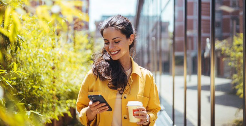 woman checking her phone, online ad viewership, online ad attribution, campaign measurement, reach real people with your online ads, attribution