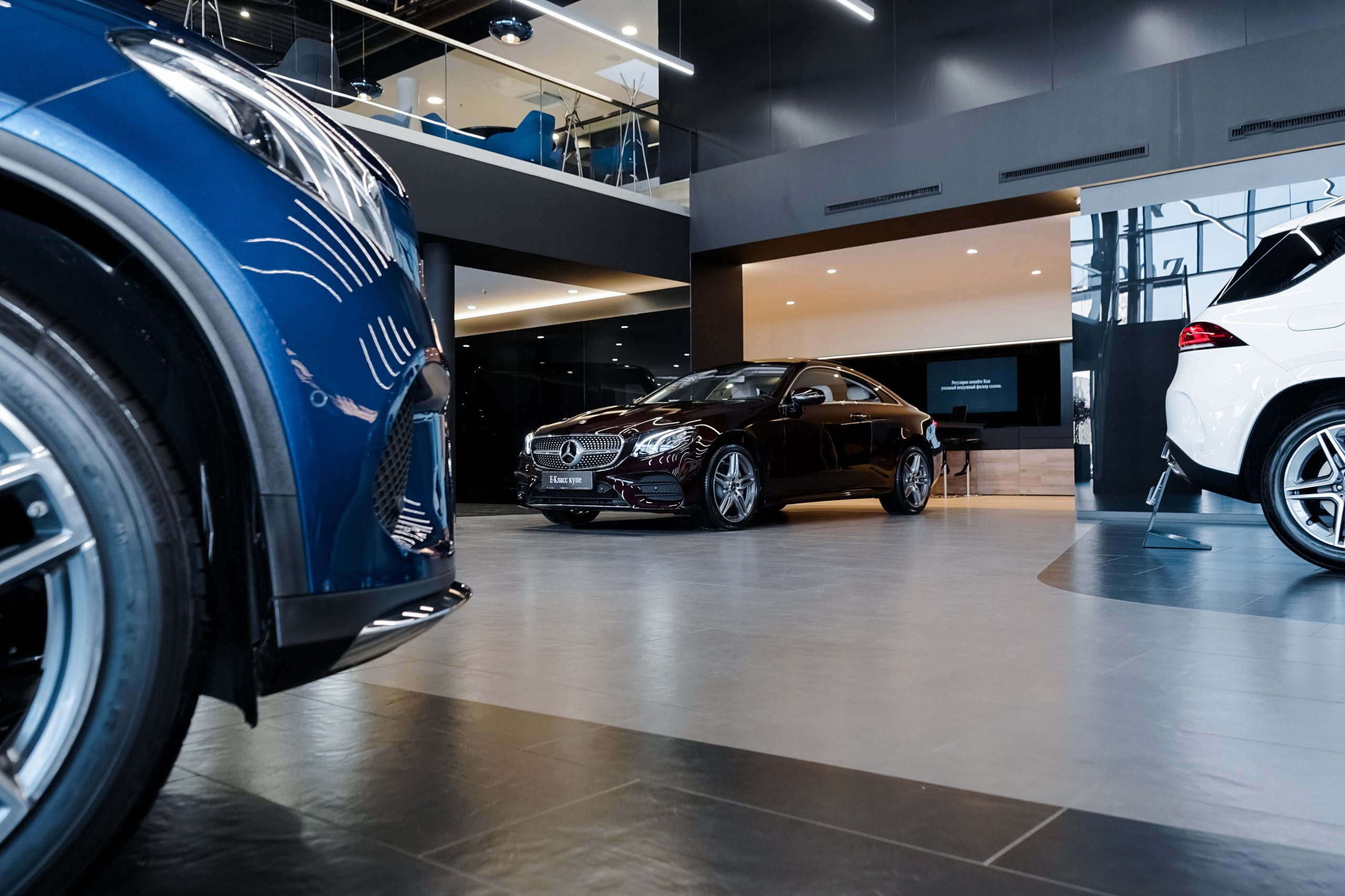 cars sitting inside a dealership