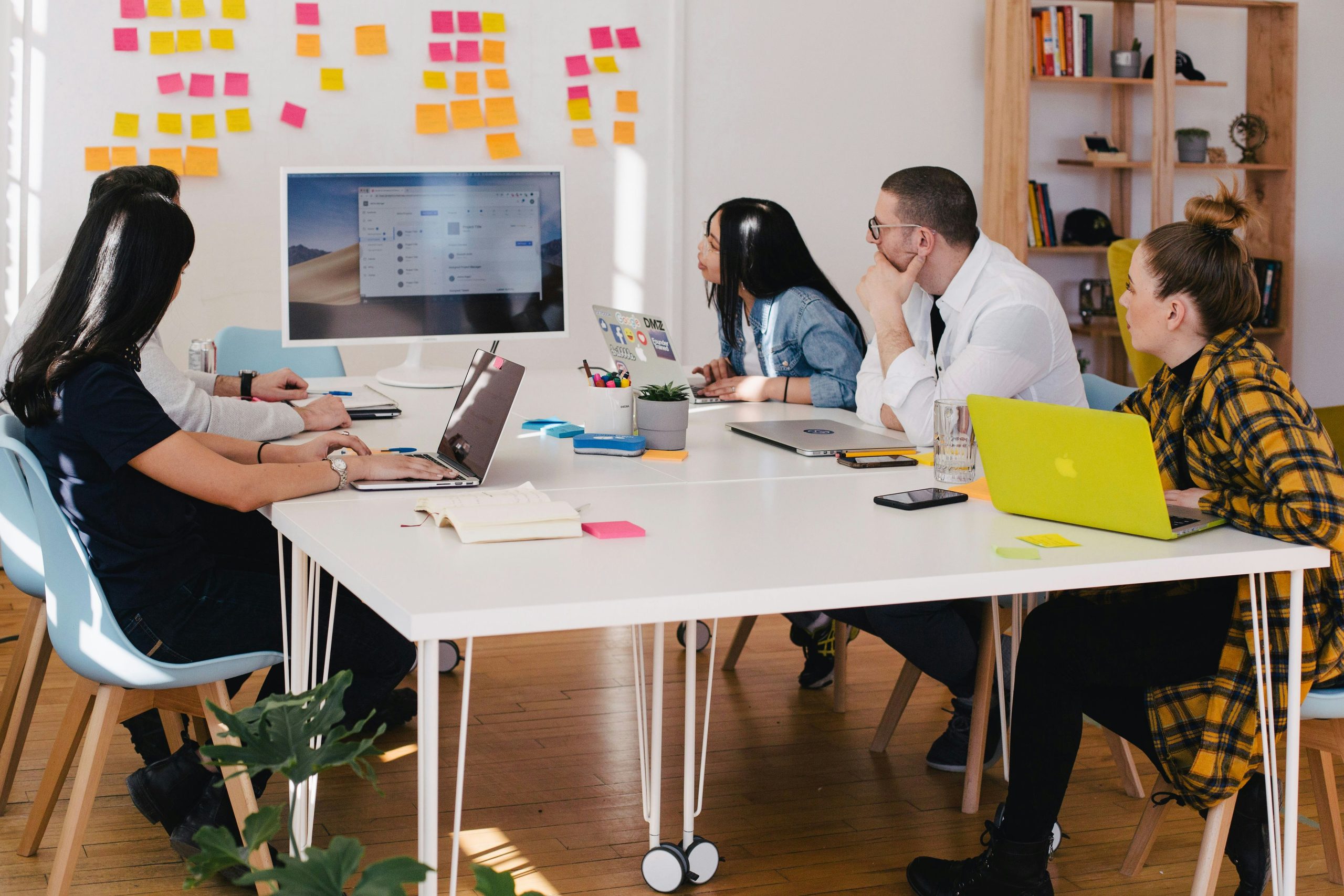 people sitting around an agency office,