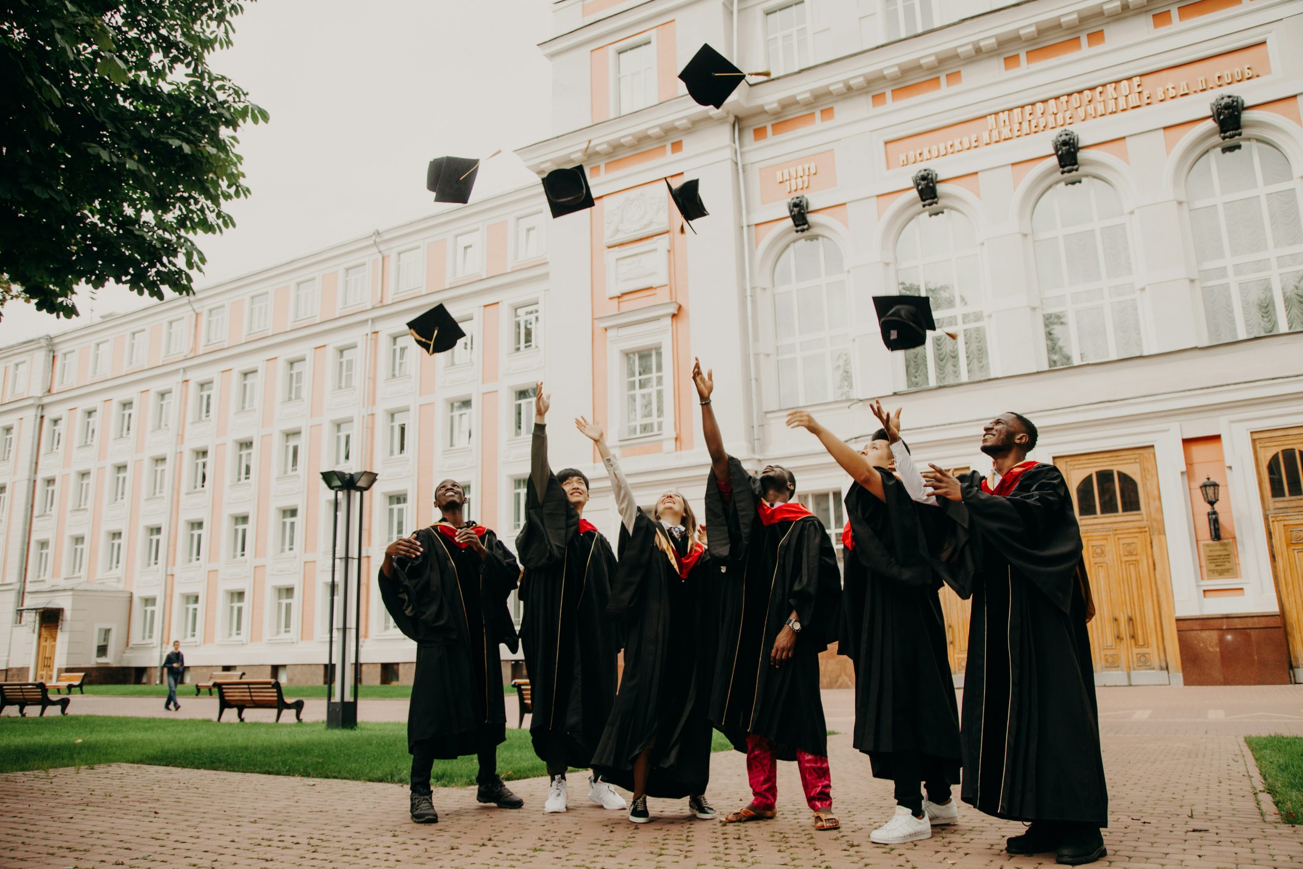 graduates, college graduation, high school graduation, graduates throwing their caps in the air
