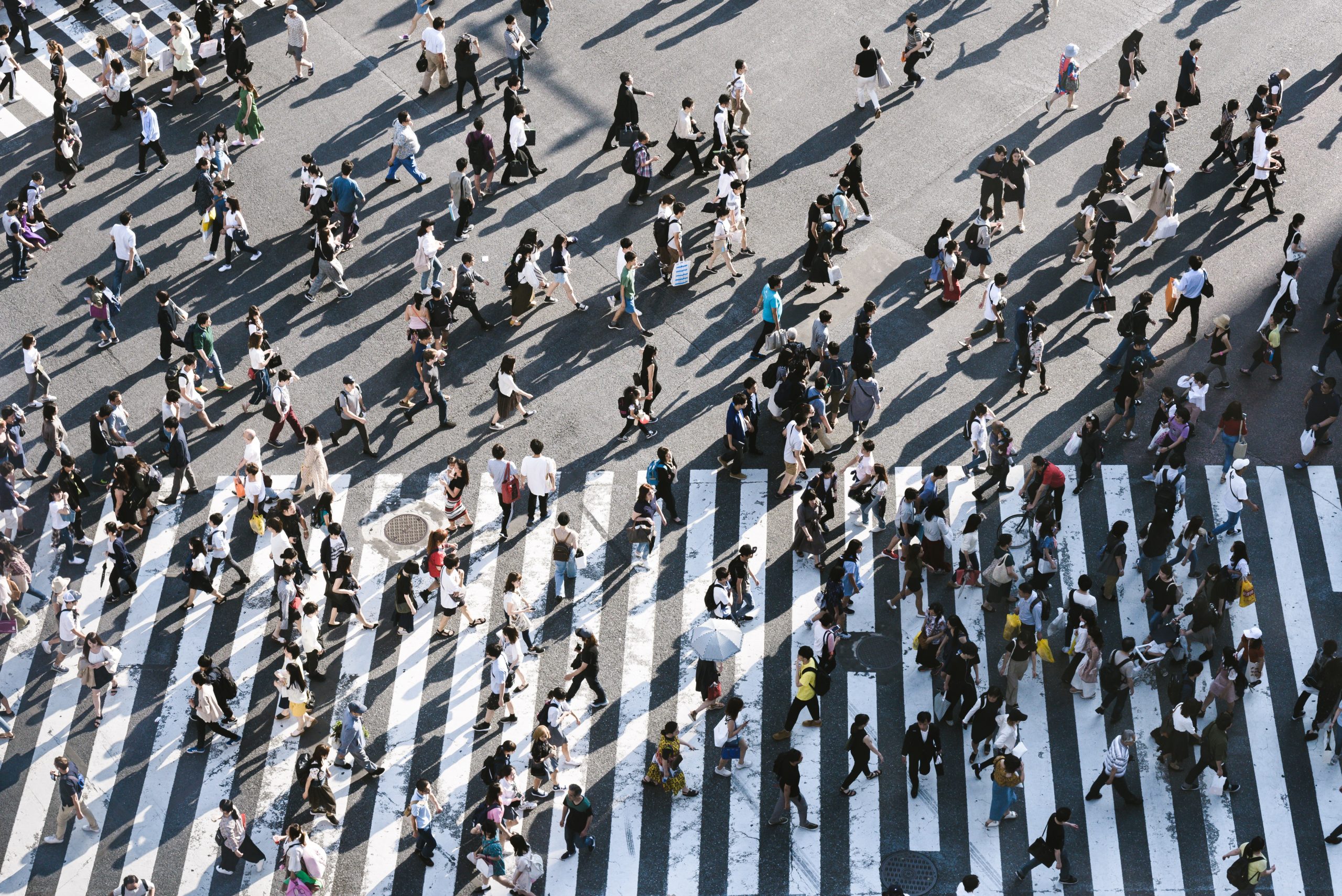 large group of people crossing the street